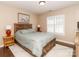 Bedroom with wood bed frame, ceiling fan, and window with blinds at 706 Springwood Dr # 14, Waxhaw, NC 28173