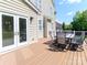 A spacious deck with a table and chairs, perfect for outdoor dining and relaxation at 706 Springwood Dr # 14, Waxhaw, NC 28173