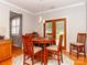 Cozy dining area with wood table, seating for four, light fixture and backyard access at 706 Springwood Dr # 14, Waxhaw, NC 28173