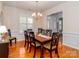 Traditional dining room featuring wood floors, chandelier, wainscoting and large window at 706 Springwood Dr # 14, Waxhaw, NC 28173