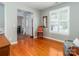 Bright living room with hardwood floors, large window and view of the entryway at 706 Springwood Dr # 14, Waxhaw, NC 28173