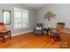 Cozy living room with hardwood floors, classic decor, and natural light from a large window at 706 Springwood Dr # 14, Waxhaw, NC 28173