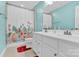 Bathroom featuring a double sink vanity, a mirror and a shower with a floral patterned curtain at 7278 Waterwheel St, Concord, NC 28025