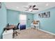 Bedroom features a desk area with a chair, computer, and ceiling fan at 7278 Waterwheel St, Concord, NC 28025