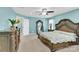 Large bedroom featuring a decorative bed, mirror, and blue accent walls at 7278 Waterwheel St, Concord, NC 28025