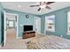Bedroom features a carpeted floor, light blue walls, and a view to the hall at 7278 Waterwheel St, Concord, NC 28025
