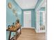 Welcoming entryway featuring wood floors, a console table and decor at 7278 Waterwheel St, Concord, NC 28025