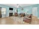 Cozy living room with a fireplace, a TV, leather furniture, and plenty of light at 7278 Waterwheel St, Concord, NC 28025