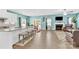 Open-concept kitchen and living area boasts natural light and plenty of space for entertaining guests at 7278 Waterwheel St, Concord, NC 28025