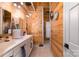 Bathroom features a double vanity, decorative lighting, and unique wood walls at 8172 Summit Ridge Dr, Catawba, NC 28609