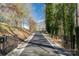 Long driveway leading to a charming home with a inviting porch and beautiful landscaping at 8172 Summit Ridge Dr, Catawba, NC 28609