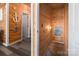 Hallway with wood walls, unique decor and view of staircase at 8172 Summit Ridge Dr, Catawba, NC 28609