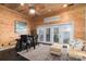 View of cozy living room with wood walls and a view to the lake at 8172 Summit Ridge Dr, Catawba, NC 28609