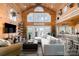 Spacious living room with vaulted ceilings, large windows, and stylish furnishings at 8172 Summit Ridge Dr, Catawba, NC 28609