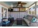 Cozy screened-in porch with a mounted tv and wicker furniture at 8172 Summit Ridge Dr, Catawba, NC 28609