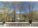 Scenic lake view from deck with trees and a boat dock at 8172 Summit Ridge Dr, Catawba, NC 28609