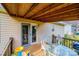Covered deck perfect for outdoor dining and relaxation with clear sliding glass door at 87 Green Meadows Dr, Taylorsville, NC 28681