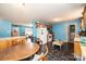 The kitchen features a breakfast bar, wooden cabinets, white appliances, and tiled flooring at 87 Green Meadows Dr, Taylorsville, NC 28681