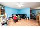Open living room with hardwood floors and a dark leather sectional sofa at 87 Green Meadows Dr, Taylorsville, NC 28681