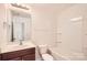 Bright bathroom featuring a vanity with sink, toilet, and a tub-shower combination for a clean and functional space at 9035 Bradstreet Commons Way, Charlotte, NC 28215