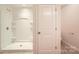 Bathroom featuring white shower, tile floor, plus view of toilet and towel rack at 9035 Bradstreet Commons Way, Charlotte, NC 28215