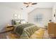 Bright bedroom with vaulted ceiling, neutral carpet, ceiling fan, and window overlooking the exterior at 9035 Bradstreet Commons Way, Charlotte, NC 28215