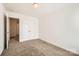 Bedroom featuring a double door closet and open doorway; carpeted for comfort and neutral color palette at 9035 Bradstreet Commons Way, Charlotte, NC 28215