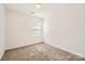 Neutral-toned bedroom featuring carpet flooring, a bright window, and an overhead light for comfortable living at 9035 Bradstreet Commons Way, Charlotte, NC 28215