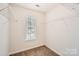 An organized closet space with wire shelving and a window providing natural light to the storage area at 9035 Bradstreet Commons Way, Charlotte, NC 28215