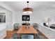 Elegant dining room featuring a modern pendant light and decorative rug, creating a stylish and inviting space at 9808 Emerald Point Dr # 10, Charlotte, NC 28278