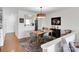 Bright dining room with modern chandelier and view to the kitchen at 9808 Emerald Point Dr # 10, Charlotte, NC 28278