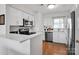 Bright kitchen features stainless steel appliances, white cabinetry, and a spacious quartz countertop at 9808 Emerald Point Dr # 10, Charlotte, NC 28278