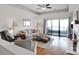 Spacious living room with modern decor, neutral color palette, and a sliding glass door to a patio at 9808 Emerald Point Dr # 10, Charlotte, NC 28278