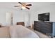 Bedroom with mounted television and access to bathroom at 9808 Emerald Point Dr # 10, Charlotte, NC 28278