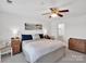 Comfortable bedroom with plush carpet and ceiling fan at 9808 Emerald Point Dr # 10, Charlotte, NC 28278