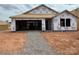 New construction home exterior with covered porch and exposed framework awaiting finishing at 1018 Cunningham Farm Dr, Indian Trail, NC 28079