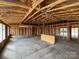 Unfinished interior featuring exposed wood framing with high ceilings and an open-concept design at 1018 Cunningham Farm Dr, Indian Trail, NC 28079