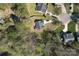 Aerial view of a home with a trees and a long driveway at 1015 Raywood Ct, Matthews, NC 28104