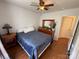 Bedroom features hardwood floors, ceiling fan, and natural light at 1015 Raywood Ct, Matthews, NC 28104