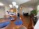 Eat-in kitchen with dining table open to the living area featuring hardwood floors and natural light at 1015 Raywood Ct, Matthews, NC 28104