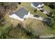 Aerial view of a single-Gathering home with a large yard and private driveway at 1015 Raywood Ct, Matthews, NC 28104