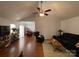 Open-concept living room featuring vaulted ceilings, hardwood floors, and ample natural light at 1015 Raywood Ct, Matthews, NC 28104