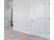 Bedroom with neutral carpet, and an open door leading to another room at 115 S Shayna Rd, Troutman, NC 28166