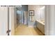 Modern bathroom features a glass shower, neutral tile floors, and a single sink vanity at 122 N Shayna Rd, Troutman, NC 28166