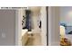 Bright bathroom featuring a shower-tub combo, patterned shower curtain, and single sink vanity at 122 N Shayna Rd, Troutman, NC 28166