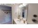 Well-lit bathroom with modern vanity, mirror and open doorway to hallway at 122 N Shayna Rd, Troutman, NC 28166