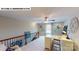 Bright bonus room with desk, chair, railing, carpet and natural light at 122 N Shayna Rd, Troutman, NC 28166