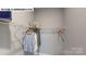 Organized walk-in closet featuring wire shelving and clothing on hangers at 122 N Shayna Rd, Troutman, NC 28166