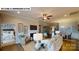 Open-concept living room with fireplace, leading into dining area and bedroom at 122 N Shayna Rd, Troutman, NC 28166