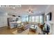 Bright, open living area with hardwood floors, a kitchen, and a fireplace at 122 N Shayna Rd, Troutman, NC 28166
